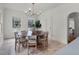 Bright dining room featuring a round wooden table and six chairs at 2004 Magnolia Ave, Sanford, FL 32771