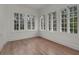 Bright and airy empty room featuring hardwood floors, white walls, and plenty of natural light at 2004 Magnolia Ave, Sanford, FL 32771
