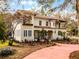 Stately two-story residence with a terra cotta tile roof, complemented by a walkway and mature landscaping at 2004 Magnolia Ave, Sanford, FL 32771