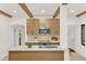 Kitchen showcasing quartz countertops, wooden beams, stainless appliances, and white backsplash at 2004 Magnolia Ave, Sanford, FL 32771