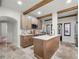 Modern kitchen featuring wood cabinets, stainless steel appliances, and an island with a sink at 2004 Magnolia Ave, Sanford, FL 32771