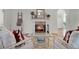 Cozy living room showcasing a marble fireplace, hardwood floors, and elegant decor at 2004 Magnolia Ave, Sanford, FL 32771