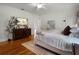 Bright main bedroom with hardwood floors, large bed, and windows that offer plenty of natural light at 2004 Magnolia Ave, Sanford, FL 32771