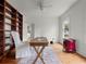 Home office with wood floors, built-in shelves, and white chair at 2004 Magnolia Ave, Sanford, FL 32771