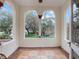 Charming porch with arched openings offering views of the landscaped front yard at 2004 Magnolia Ave, Sanford, FL 32771