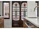 These decorative wooden doors feature unique stained glass panels at 2004 Magnolia Ave, Sanford, FL 32771
