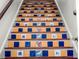 Unique staircase with colorful decorative tile risers adds a touch of artistry to the home's interior at 2004 Magnolia Ave, Sanford, FL 32771