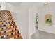 A distinctive staircase boasting colorful Spanish tiles on each step leads up from the home's entrance at 2004 Magnolia Ave, Sanford, FL 32771