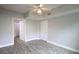 Bright bedroom with ceiling fan and two closets and wood-look flooring at 202 E South St # 1042, Orlando, FL 32801