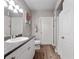 Bathroom featuring a single sink vanity, gray walls, and a shower/tub combo at 204 E South St # 2052, Orlando, FL 32801
