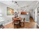 Light and airy dining area features a track lighting system and wood flooring next to the kitchen at 204 E South St # 2052, Orlando, FL 32801