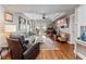 Inviting living room with comfortable seating, wood floors, and bright light from the backyard at 204 E South St # 2052, Orlando, FL 32801