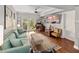 Open living room featuring comfortable seating, wood floors, and french doors to backyard at 204 E South St # 2052, Orlando, FL 32801