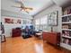 Large office with natural light, wood floors, ceiling fan, and built in bookshelves at 204 E South St # 2052, Orlando, FL 32801