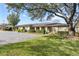 Building exterior showcasing a charming building with lush landscaping and ample parking at 208 Diamond Cv # 104, Casselberry, FL 32707