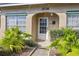 Inviting front door entrance with a classic design and well-maintained landscaping at 208 Diamond Cv # 104, Casselberry, FL 32707