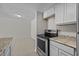 Modern kitchen with stainless steel appliances and granite countertops at 208 Diamond Cv # 104, Casselberry, FL 32707