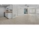 Open concept kitchen and living area with tile floors and modern appliances at 208 Diamond Cv # 104, Casselberry, FL 32707