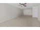 Large living room with tile floors, ceiling fan, and access to other rooms at 208 Diamond Cv # 104, Casselberry, FL 32707