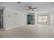 Spacious living area with tile floors, a ceiling fan, and neutral wall colors at 208 Diamond Cv # 104, Casselberry, FL 32707