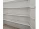 White pantry shelves offering ample storage space at 208 Diamond Cv # 104, Casselberry, FL 32707