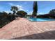 Community swimming pool with surrounding patio at 208 Diamond Cv # 104, Casselberry, FL 32707