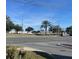Street view of the community, showing nearby businesses and traffic at 208 Diamond Cv # 104, Casselberry, FL 32707