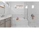 Spa-like bathroom features marble finishes and a large walk-in shower at 2309 Depauw Ave, Orlando, FL 32804