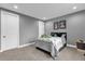 Cozy bedroom with gray walls and a comfy bed at 2309 Depauw Ave, Orlando, FL 32804