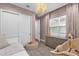 Light and bright bedroom with twin bed, dresser, and window seat at 2309 Depauw Ave, Orlando, FL 32804