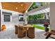 Covered patio with dining table and small pool view at 2309 Depauw Ave, Orlando, FL 32804