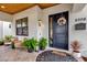 Welcoming front porch with stylish seating and a black front door at 2309 Depauw Ave, Orlando, FL 32804