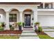 Front porch with stylish seating and a black front door at 2309 Depauw Ave, Orlando, FL 32804