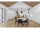 Open concept kitchen with island, stainless steel appliances, and white cabinetry at 2309 Depauw Ave, Orlando, FL 32804