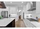 Spacious kitchen with white cabinets, stainless steel appliances, and a large island at 2309 Depauw Ave, Orlando, FL 32804
