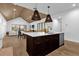 Open concept kitchen with large island and access to the living room at 2309 Depauw Ave, Orlando, FL 32804