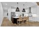 Modern kitchen with island, stainless steel appliances, and hardwood floors at 2309 Depauw Ave, Orlando, FL 32804