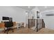 Spacious loft area with desk, chairs, and built-in shelving at 2309 Depauw Ave, Orlando, FL 32804