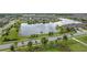 Scenic aerial view of the community, featuring a large pond, green spaces, and well-maintained landscaping at 2464 Rapollo Dr, Kissimmee, FL 34741