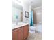 Bathroom featuring a sink, toilet and shower at 2553 Dharma Cir, Kissimmee, FL 34746