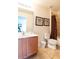 Full bathroom with tub and wood vanity at 2553 Dharma Cir, Kissimmee, FL 34746