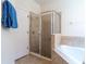 Nicely tiled bathroom with glass enclosed shower, and soaking tub at 2553 Dharma Cir, Kissimmee, FL 34746