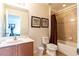 Full bathroom with tub and wood vanity at 2553 Dharma Cir, Kissimmee, FL 34746