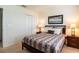 Bedroom with a bed and two night stands with a view of a wall at 2553 Dharma Cir, Kissimmee, FL 34746