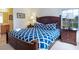 Bedroom with a bed and two night stands, with a view out the window at 2553 Dharma Cir, Kissimmee, FL 34746