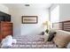 Comfortable bedroom with a queen-size bed and striped bedding at 2553 Dharma Cir, Kissimmee, FL 34746