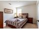 Cozy bedroom with a double bed and wood frame at 2553 Dharma Cir, Kissimmee, FL 34746