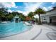 Large community pool with a water slide and play area at 2553 Dharma Cir, Kissimmee, FL 34746