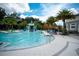 Large community pool with a water slide and play area at 2553 Dharma Cir, Kissimmee, FL 34746