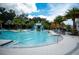 Large community pool with a water slide and play area at 2553 Dharma Cir, Kissimmee, FL 34746